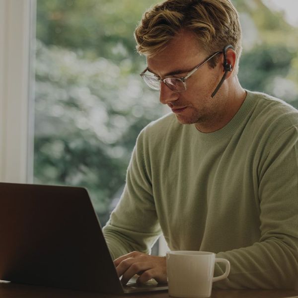 Yealink BH71 used in a professional work setting