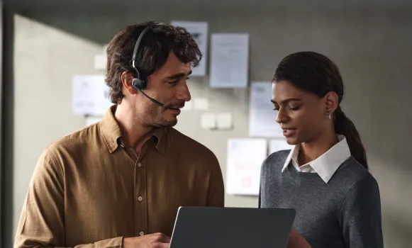 Shokz OpenComm Bluetooth headphones with microphone and hands-free design